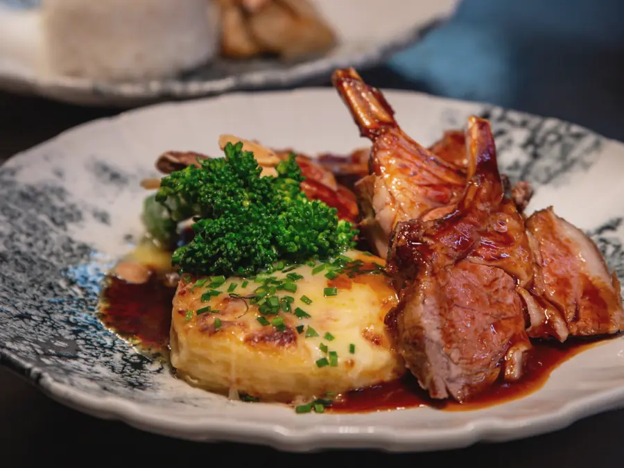 Lamb with a potato gratin, herbs and a rich jus